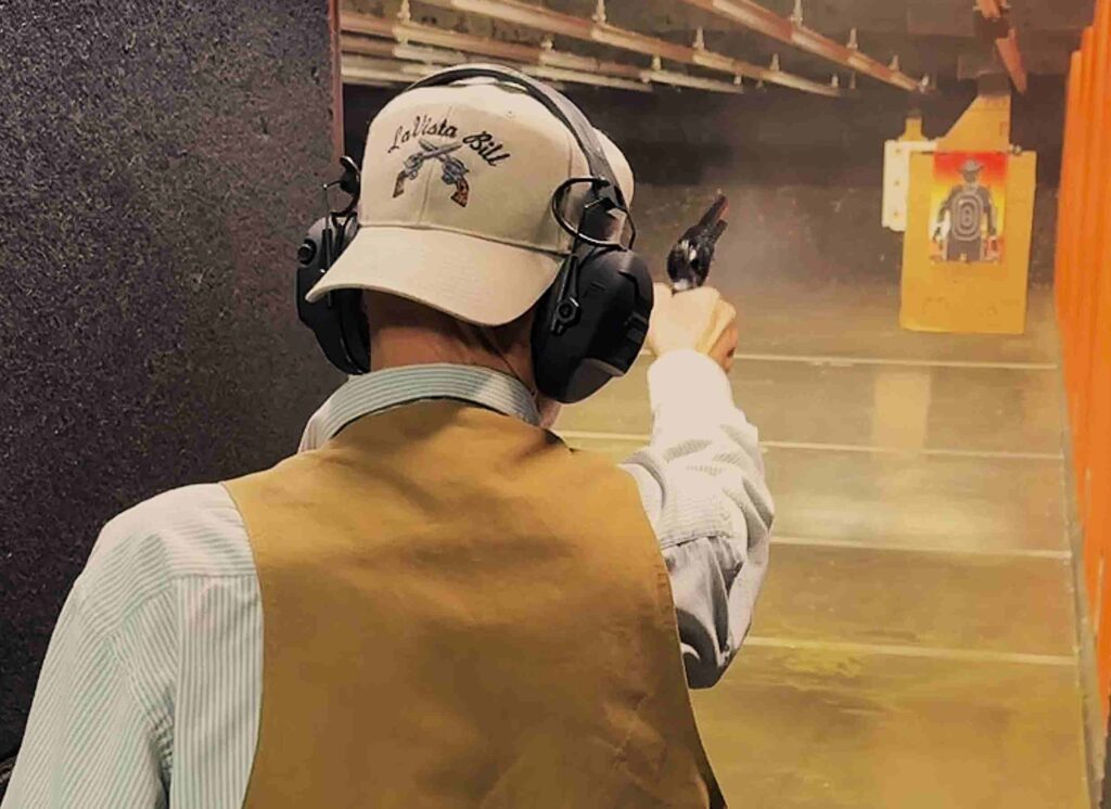 Photo of author shooting a cowboy target 