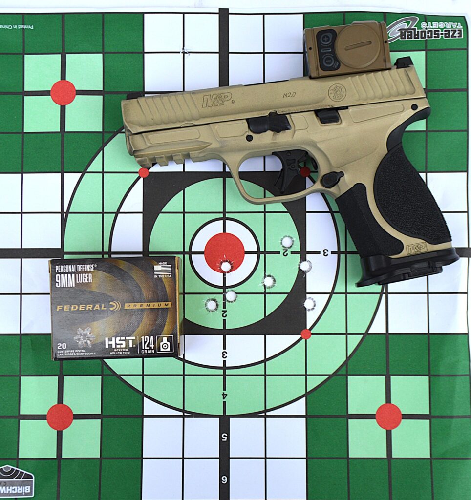 Photo of gun on target with shooting results
