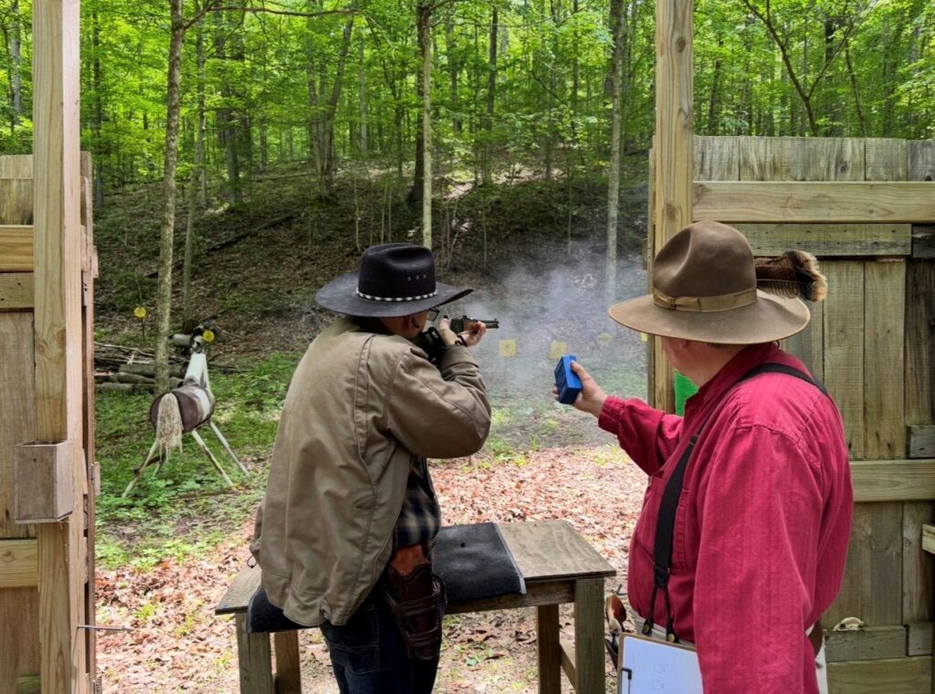 Cowboys shooting rifles